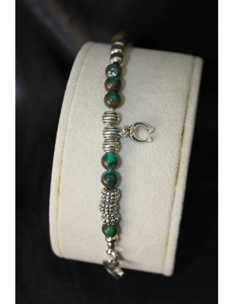 Bracciale con pietre e amuleto in argento